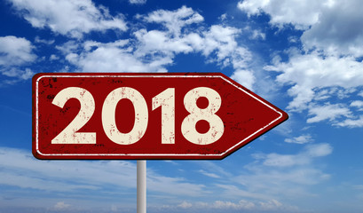 2018 metallic vintage sign over blue sky with clouds