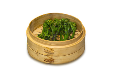 Steamed broccoli in a bamboo bowl 