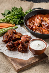 Buffalo chicken wings cooking. Food background.