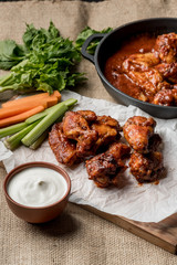 Buffalo chicken wings cooking. Food background.
