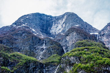 Fototapeta na wymiar Steep eroded cliffs near Sognefjord, Norway.