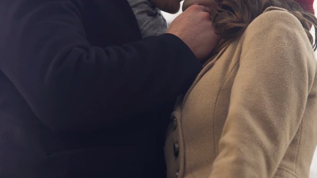 Lovers tightly clinging to each other and passionately kissing, romantic date