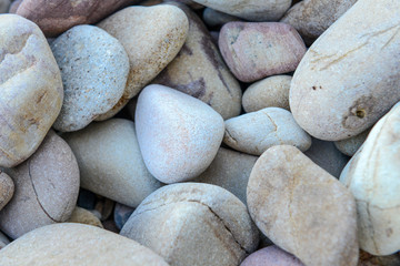 Close up of rounded and polished beach rocks