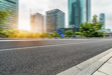 Empty asphalt road through modern city in Shanghai, China.
