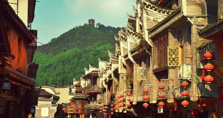 Fenghuang, China - May 15, 2017: Shops street near Phoenix Hong Bridge in Fenghuang