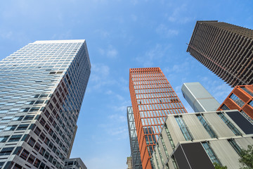 Modern office building against blue sky.