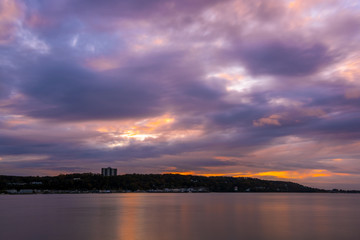 Gloomy evening at Sandy Hook Bay creates and amazing dramatic sky during sunset 