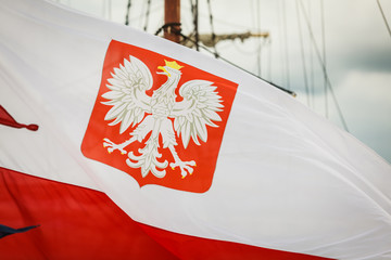 Closeup of polish national flag with emblem