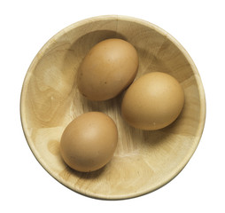 egg in wood bowl on white background included clipping path
