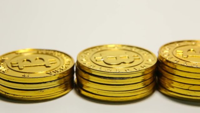 The  Gold Bitcoin or BTC image Macro shots crypto currency Bitcoin coins electronic money footage camera slide on white background.