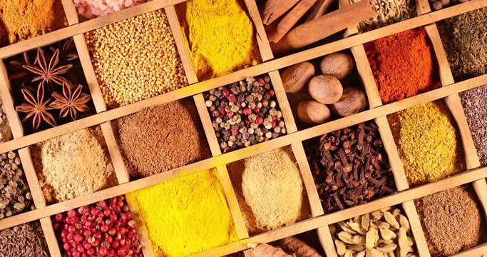 Wooden box with spices and herbs