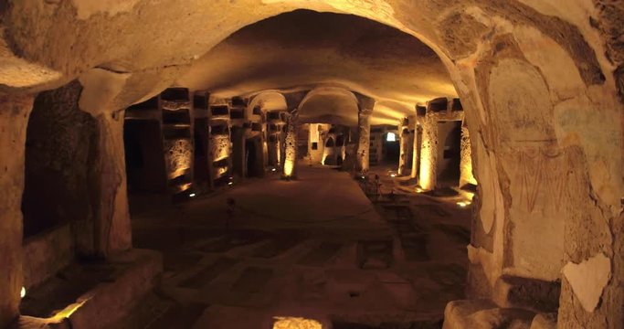 NAPLES, ITALY &ndash; JULY 2016 : Video shot in Catacombe di Napoli / Naples Catacombs with lights and carvings in view