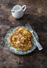 Pancakes with honey on a wooden table. Delicious breakfast, dessert or snack