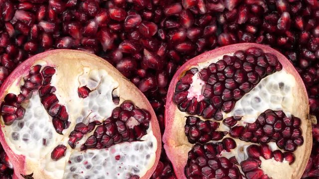 Rotating pomegranate seeds, top view, 4K.