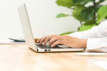 Businessman working on laptop in office