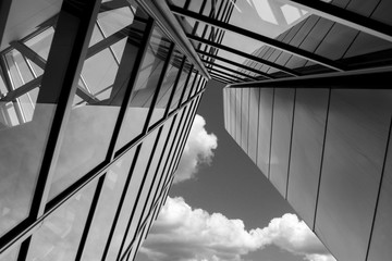 black and white Tall Building with Clouds in the background 