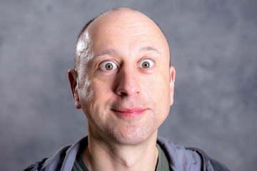 young man looking amazed in to the camera