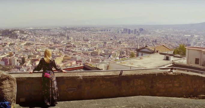 NAPLES, ITALY &ndash; JULY 2016 : Video shot of beautiful blonde girl enjoying the amazing view from Castel Sant Elmo on a sunny day