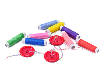 Sewing thread and buttons isolated on white background. Free space for text.