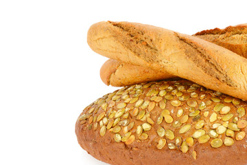 Baguette and bread with pumpkin seeds. Isolated on white background . Top view. Free space for text.