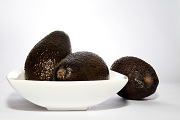 juicy avocado pear sitting on a table