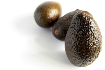 avocado sitting on a table stock photo	