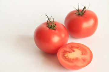 tomato sitting on a table stock photo	