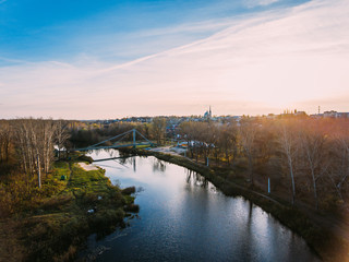 Golden red sunlight AERIAL view, Russia, River, small town, bridge