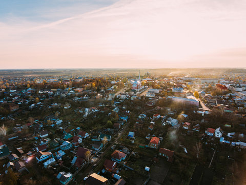 Golden red sunlight AERIAL view, Russia, River, small town, bridge