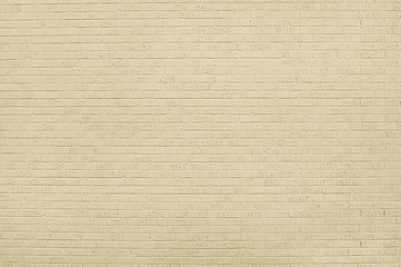 Old beige brick wall background texture