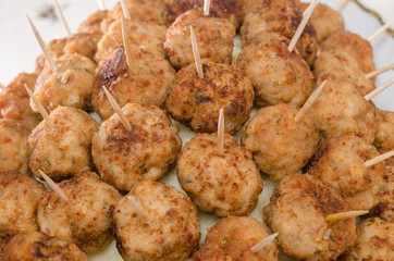 Meatball appetizers with toothpicks on the side
