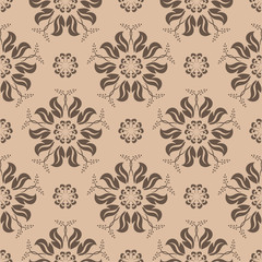 Brown floral ornament on beige background. Seamless pattern