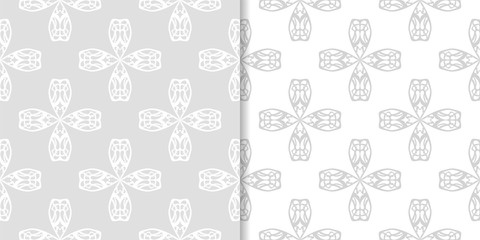 Fototapeta premium Light gray floral backgrounds. Set of seamless patterns
