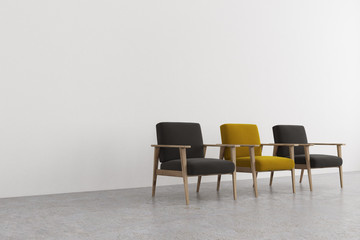 Black and yellow armchairs in an empty room side