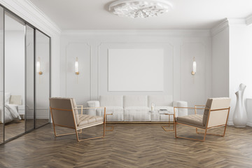 White waiting room interior, poster, and armchairs