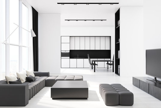 White living room corner with a gray sofa