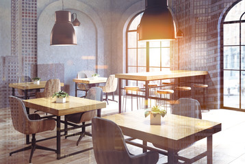 Concrete cafe corner, wooden tables close up toned