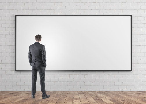 Businessman looking at whiteboard