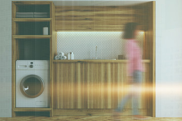 White and wooden laundry room, close up blur