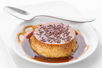 chocolate flan isolated on white