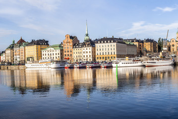 Fototapeta na wymiar Stockholm daylight skyline panorama of Gamla Stan with white ships