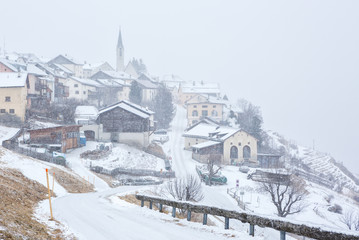 Fototapeta na wymiar Guarda village at snowfall, Lower Engadine, Graubunden; Switzerland