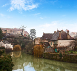 Fototapeta na wymiar Old houses on the River Armancon, Semur-en-Auxois, eastern France.
