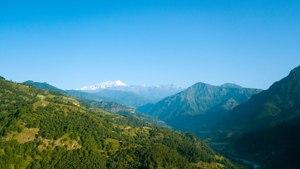Naklejka premium Sunrise above peak in the Himalaya range, Nepal