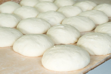 Fototapeta na wymiar Fresh dough on the wooden board, pizza, Georgian bread