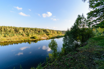 high water level in river Gauja, near Valmiera city in Latvia. summer trees surrounding