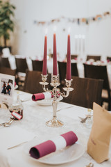 Decoration for a wedding table with pink candles