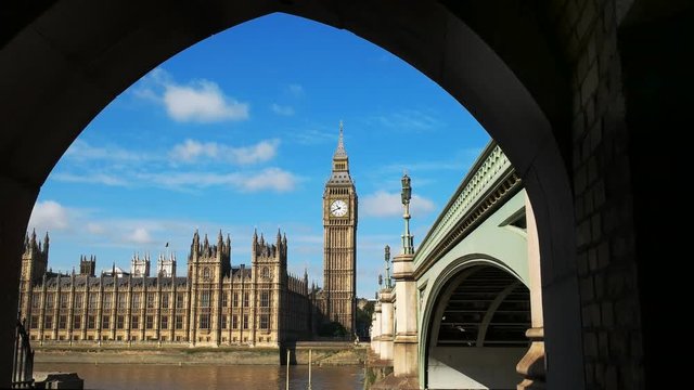 big ben framed by the arch of a bridge in london, england