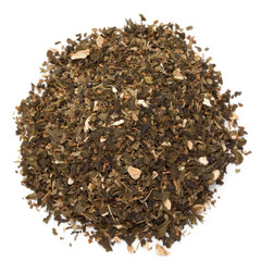 Organic Ginger Tulsi green tea. Isolated on white background. Macro closeup. Top view.
