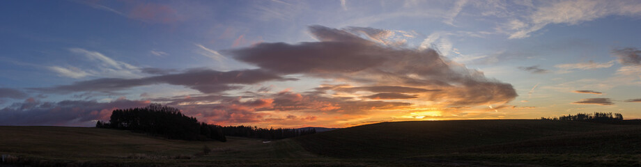 Landscape with colorful sunrise clouds panorama